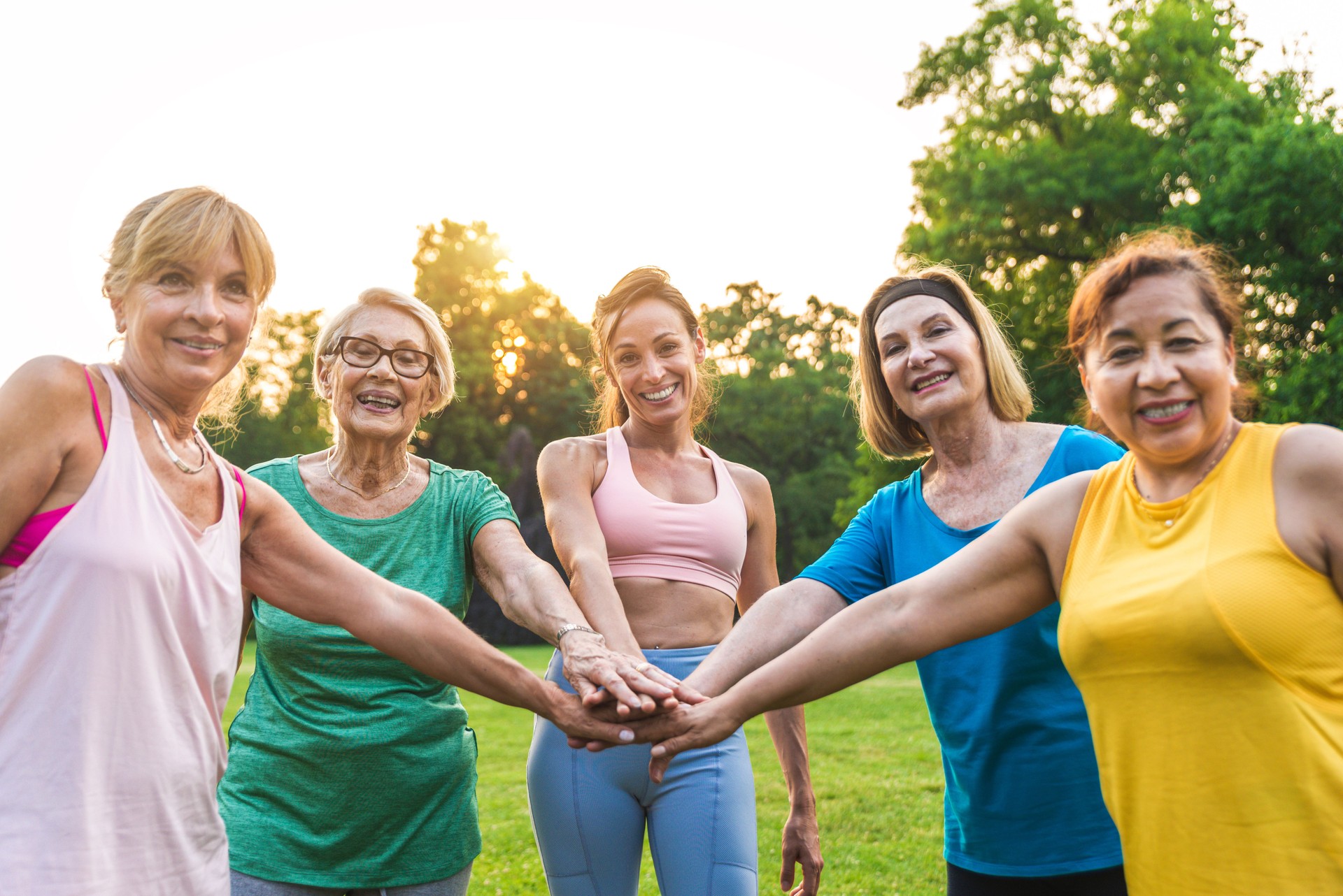 Senior women training with fitness coach at park